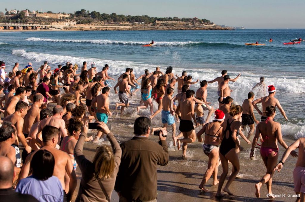 Bathers celebrating the end of the year during Christmas in Tarragona.